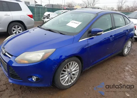 2014 Ford Focus Titanium z USA, uszkodzony, nr VIN 1FADP3J26EL253124